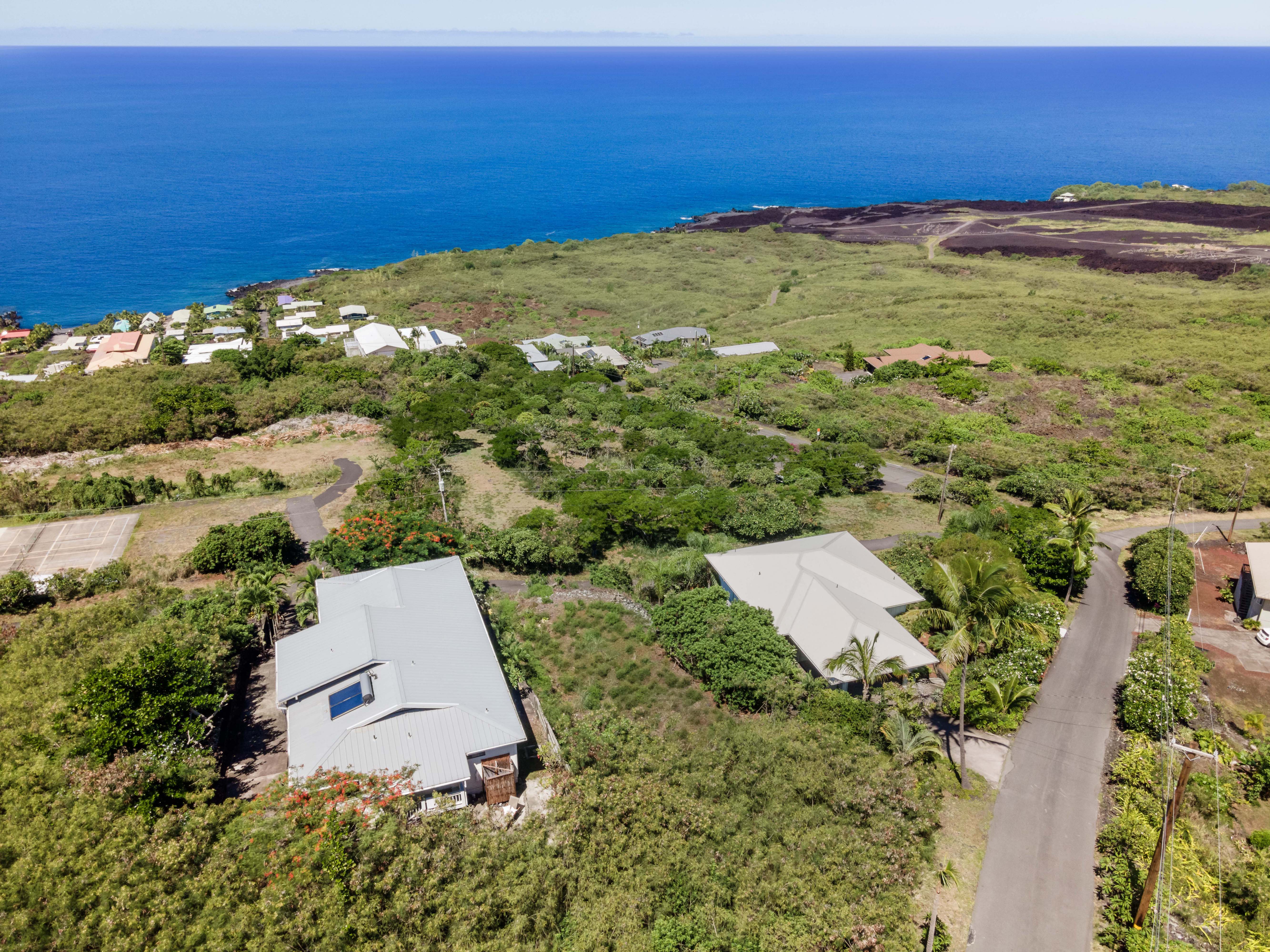 204 Road H Captain Cook Hi 96704 Captain Cook, HI 96704 - Photo 3 of 20 an aerial view of ocean with residential house and ocean view