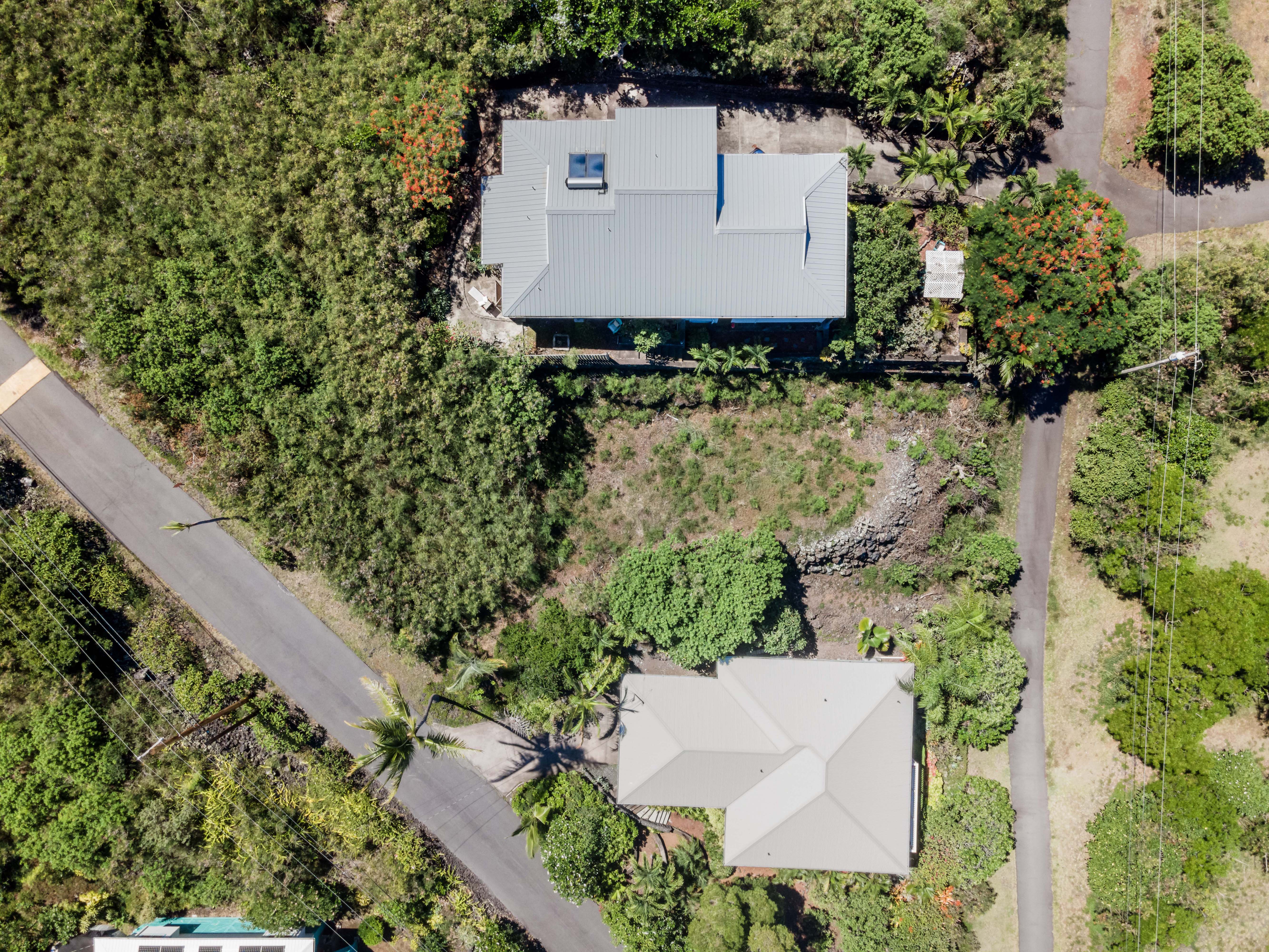 204 Road H Captain Cook Hi 96704 Captain Cook, HI 96704 - Photo 5 of 20 an aerial view of a house with a yard and trees all around