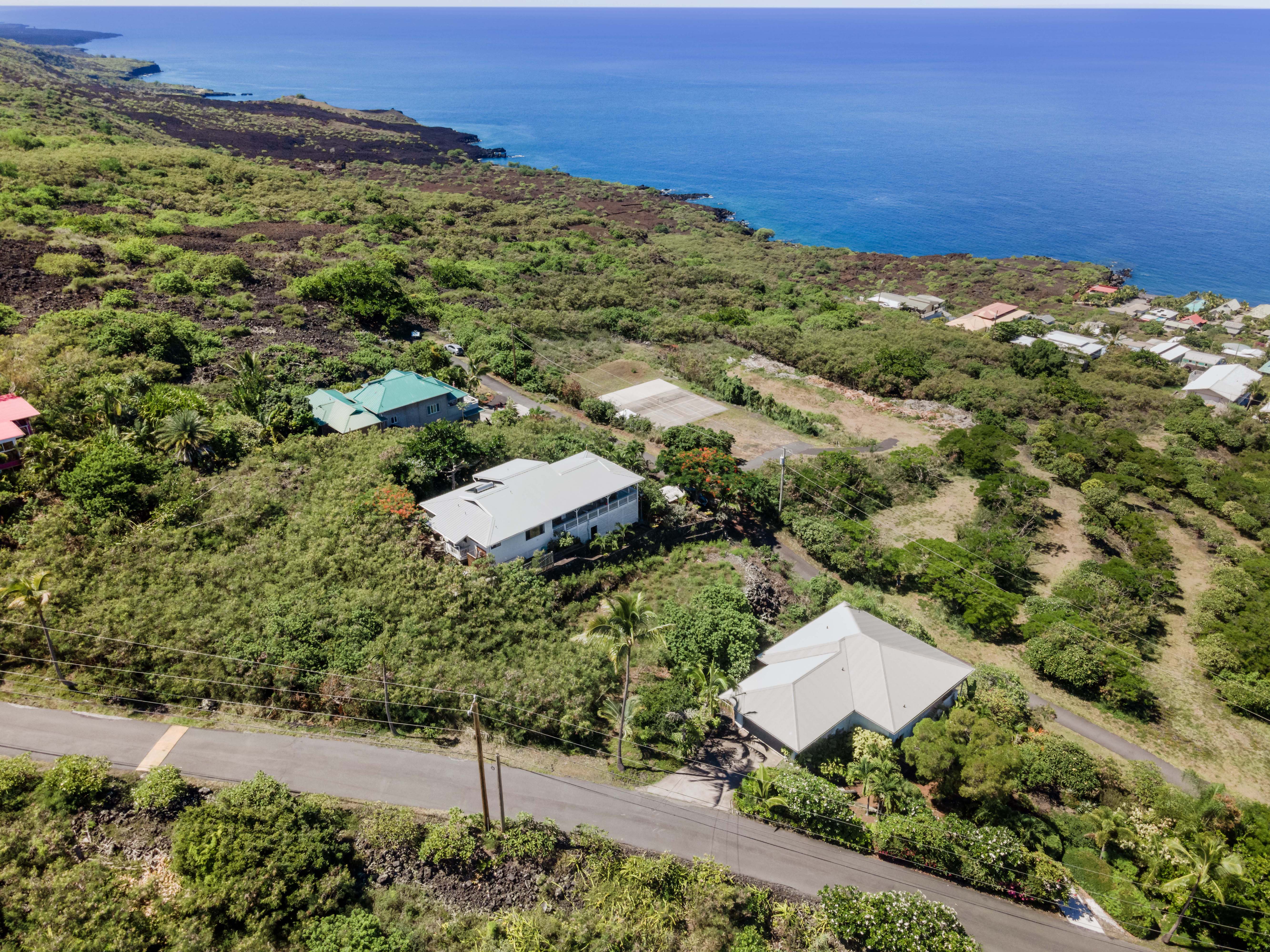 204 Road H Captain Cook Hi 96704 Captain Cook, HI 96704 - Photo 6 of 20 an aerial view of a house with a yard
