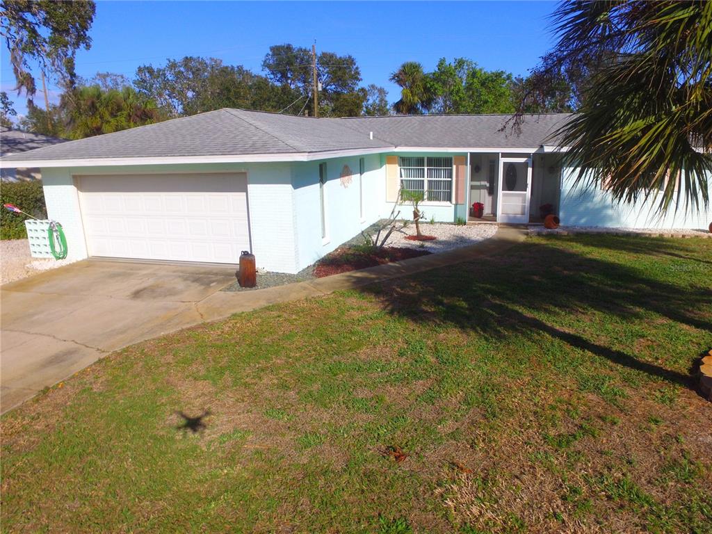 front view of a house with a yard