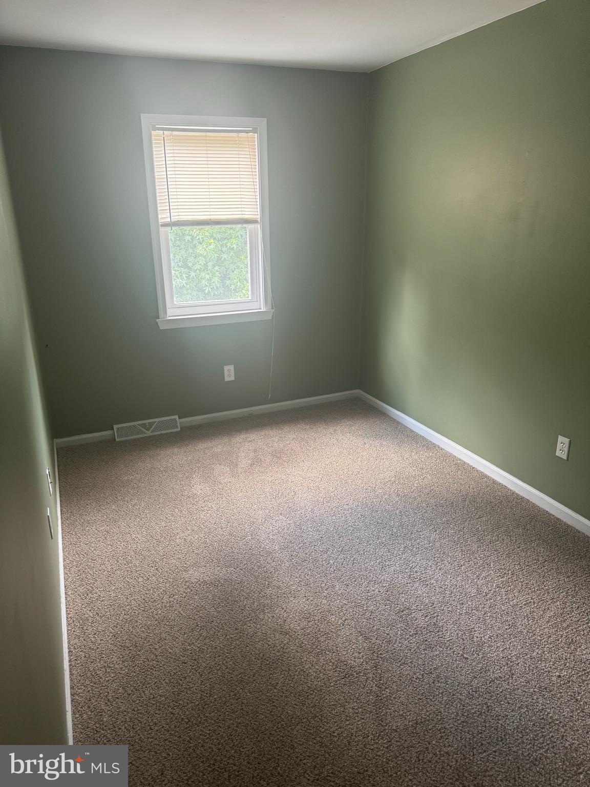 8 Forest Creek Drive Dover, DE 19904 - Photo 3 of 8 an empty room with a window