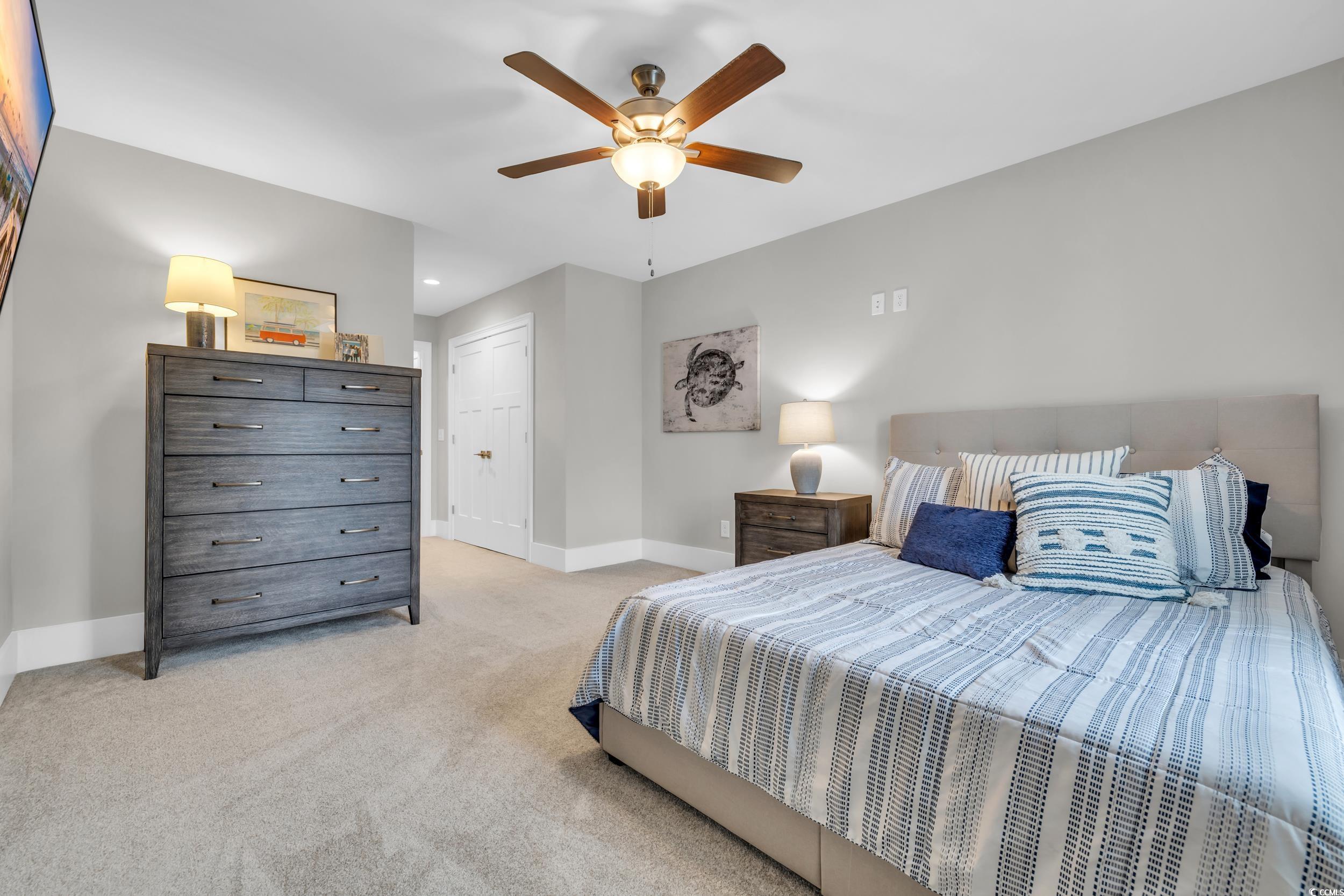 22 Trigger Fish Lane Murrells Inlet, SC 29576 - Photo 24 of 39 Bedroom with a closet, light colored carpet, and ceiling fan