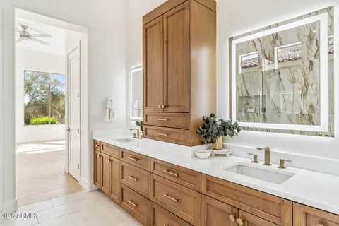 a bathroom with a sink vanity and toilet