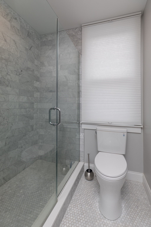 260 Amory Street Boston, MA 02130 - Photo 12 of 20 a bathroom with a toilet and a shower