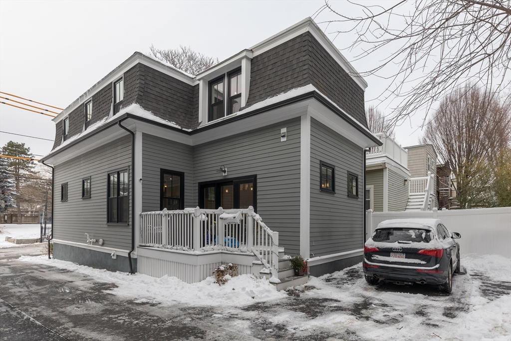 260 Amory Street Boston, MA 02130 - Photo 19 of 20 a car parked in front of white house