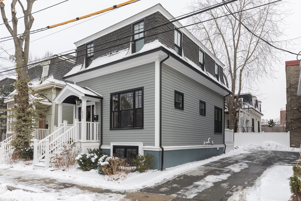 260 Amory Street Boston, MA 02130 - Photo 20 of 20 a front view of a house with a yard and garage