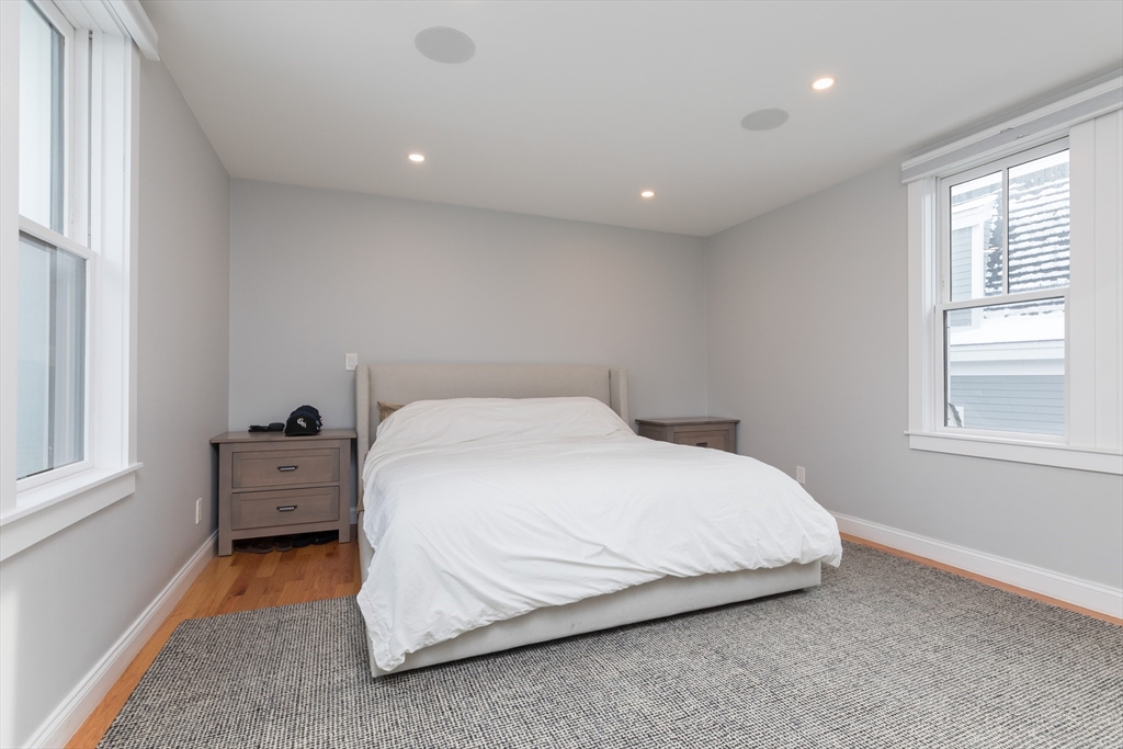 260 Amory Street Boston, MA 02130 - Photo 9 of 20 a spacious bedroom with a bed and a window