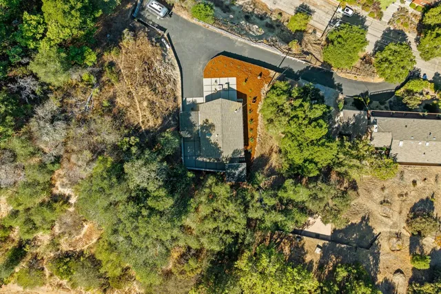 a backyard of a house with a yard and outdoor seating