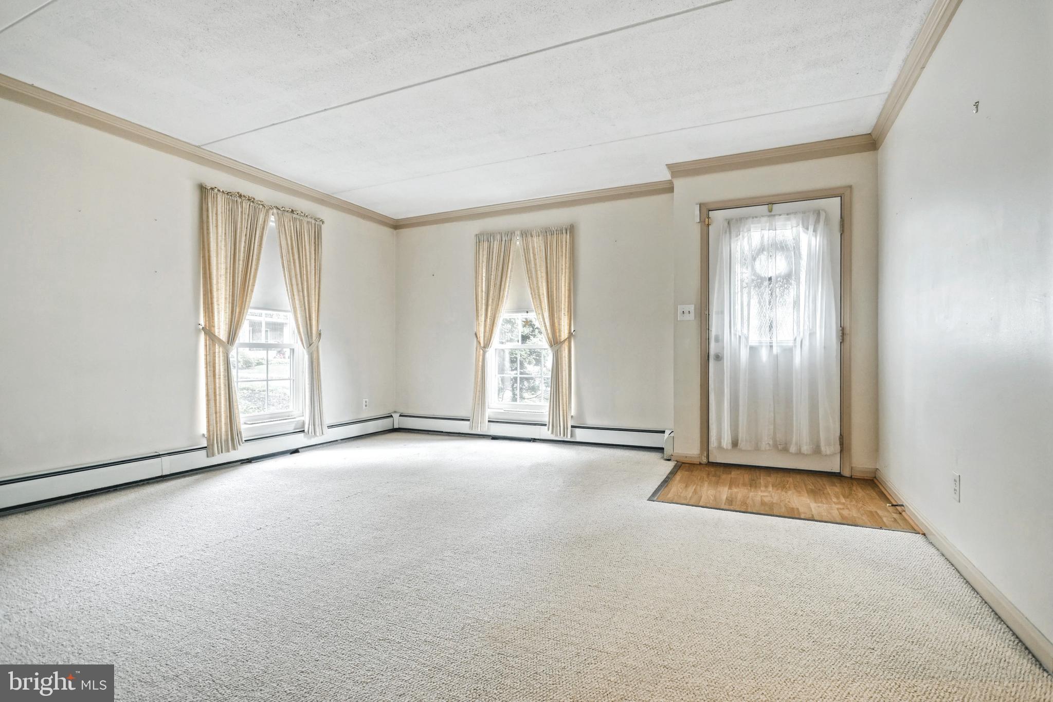 1000 Country Club Road, Unit 13 York, PA 17403 - Photo 6 of 24 Living Room wall to wall berber carpet