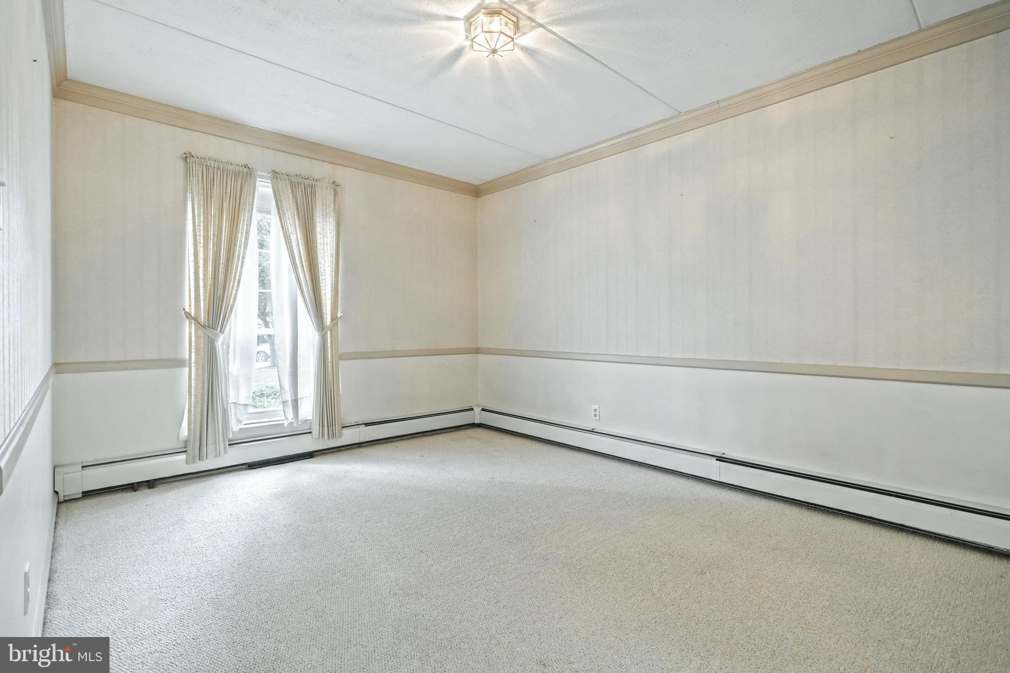1000 Country Club Road, Unit 13 York, PA 17403 - Photo 9 of 24 Chair rail and Crown Molding in DR