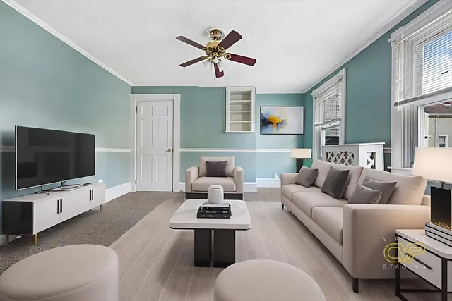 a living room with furniture and a flat screen tv