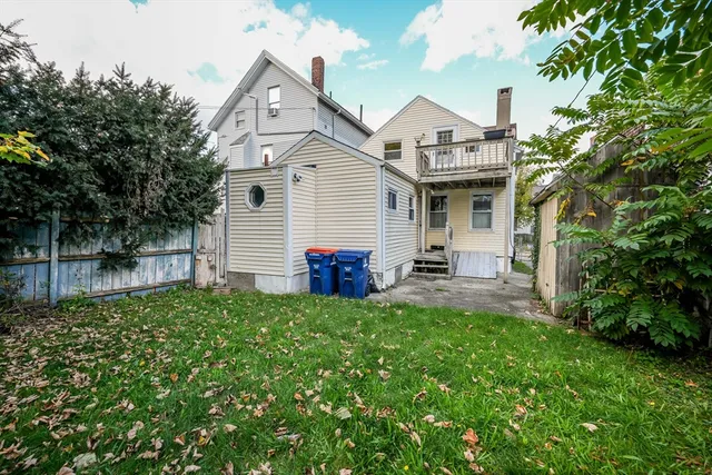 a view of a house with a chairs in a patio