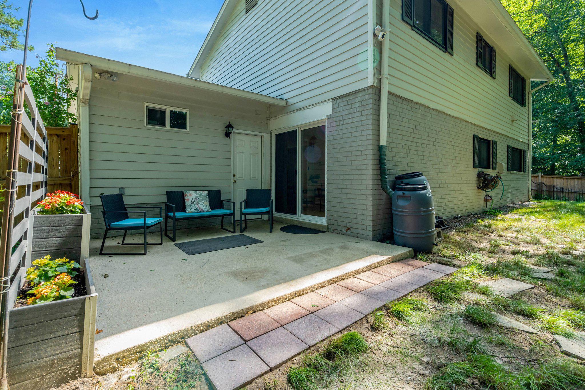 8213 Springfield Village Drive Springfield, VA 22152 - Photo 20 of 25 Back patio overlooking lush backyard