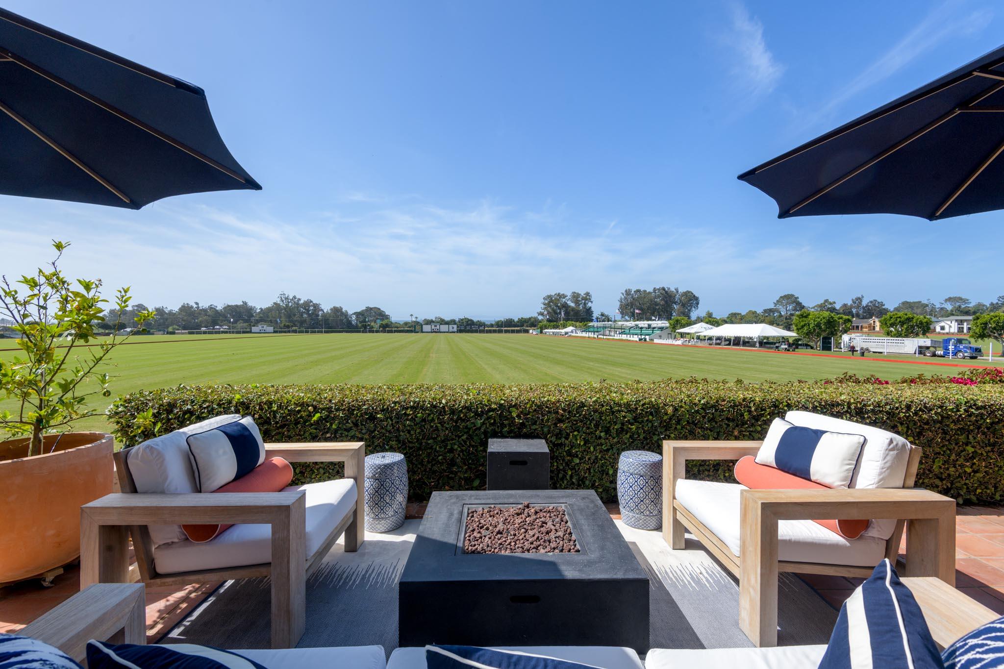 a view of a lake with couches and city view