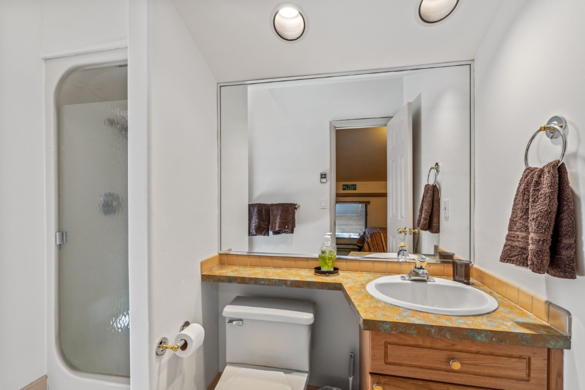 1724 Ski Time Square Drive, Unit R5 Steamboat Springs, CO 80487 - Photo 14 of 19 Ensuite bathroom featuring a shower stall, toilet, and vanity