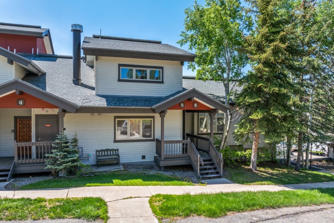 1724 Ski Time Square Drive, Unit R5 Steamboat Springs, CO 80487 - Photo 16 of 19 View of front facade featuring roof with shingles and a porch