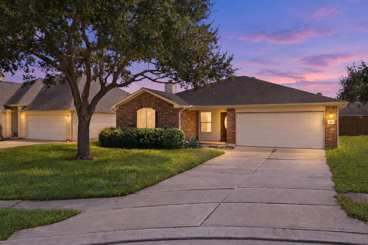 6911 River Road Richmond, TX 77469 - Photo 1 of 36 Welcome to 6911 River Road, a single-story brick residence presenting exceptional investment potential on a quiet cul-de-sac lot. Featuring 3 bedrooms, 2 bathrooms, an attached two-car garage, and a double-wide driveway, the property showcases outstanding outdoor living highlighted by a private in-ground pool, relaxing hot tub, and pergola. Inside, discover functional single-level living complete with a gas-equipped kitchen, central fireplace, and a private primary retreat with an ensuite bath.