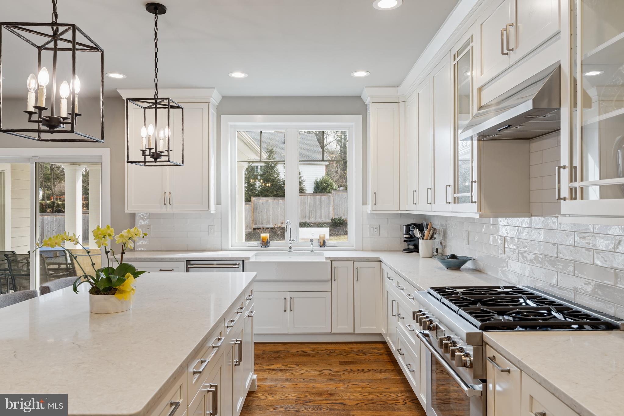 601 Spruce Lane Villanova, PA 19085 - Photo 11 of 27 a kitchen that has a lot of cabinets in it and wooden floors