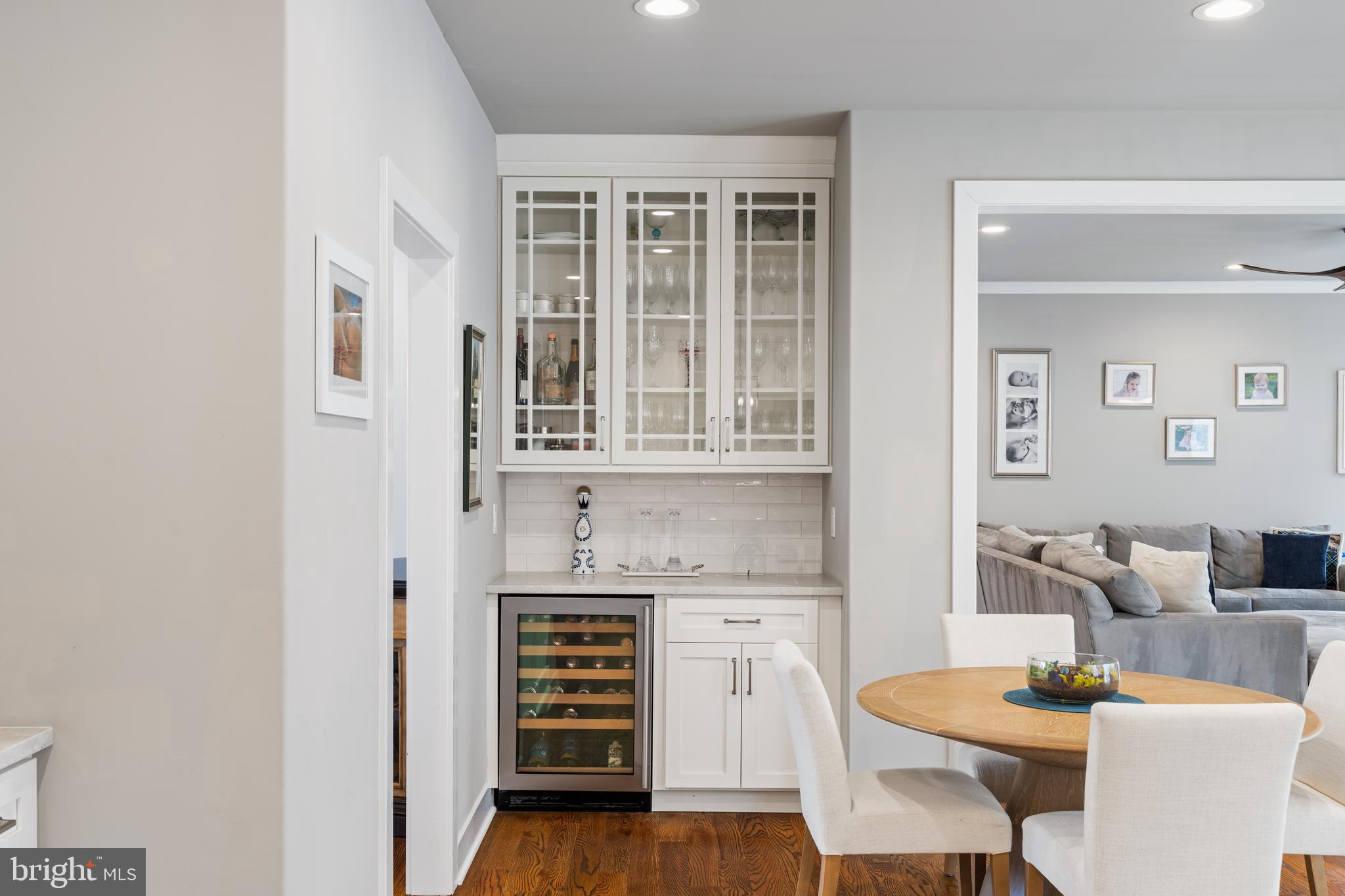 601 Spruce Lane Villanova, PA 19085 - Photo 12 of 27 a dining room with stainless steel appliances kitchen island granite countertop a table and chairs in it