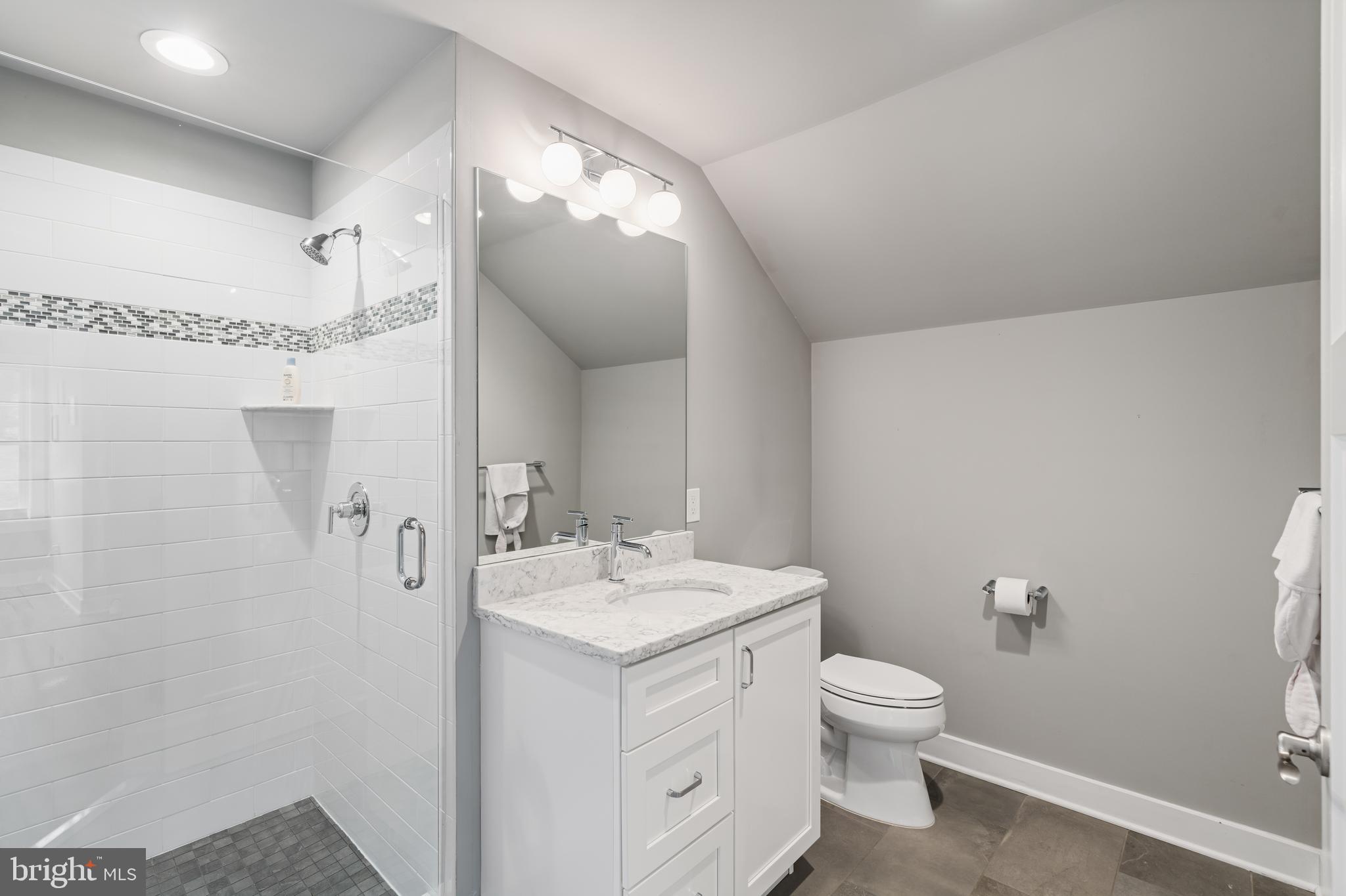 601 Spruce Lane Villanova, PA 19085 - Photo 17 of 27 a bathroom with a toilet a sink and mirror