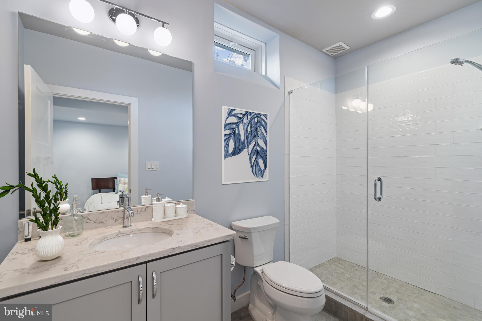 601 Spruce Lane Villanova, PA 19085 - Photo 24 of 27 a bathroom with a sink vanity mirror and toilet