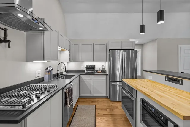 a view of kitchen with furniture and a ceiling fan