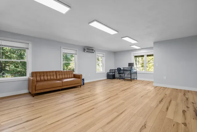 a view of a livingroom with furniture and wooden floor