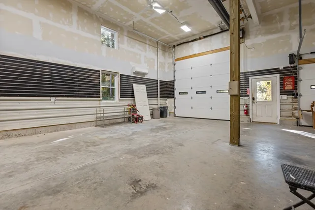 a view of a livingroom with couch and a ceiling fan