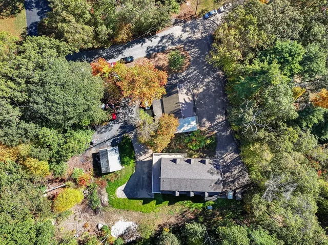 a view of a house with a yard and garden