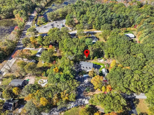 an aerial view of residential building and lake