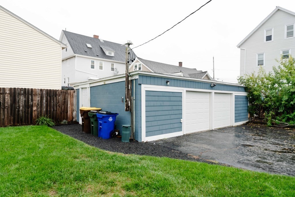400 Anthony Street Fall River, MA 02721 - Photo 29 of 32 a view of a house with a yard and garage