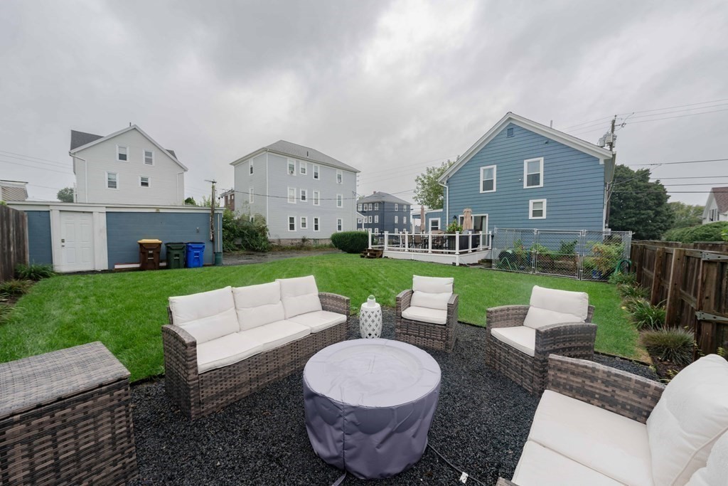 400 Anthony Street Fall River, MA 02721 - Photo 30 of 32 a view of a house with backyard sitting area and garden