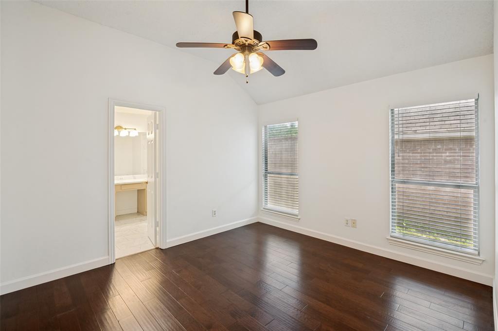 8160 Tower Road Frisco, TX 75035 - Photo 14 of 25 a view of an empty room with wooden floor and a window