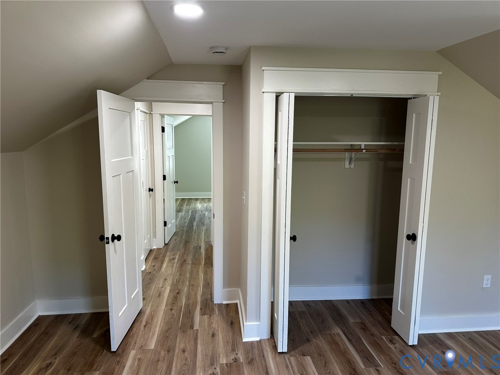 595 Liberty Road Alberta, VA 23821 - Photo 22 of 24 a view of a hallway with wooden floor and staircase