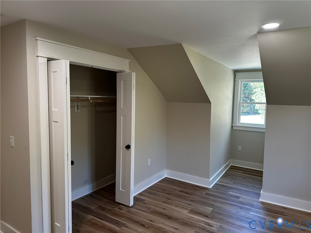 595 Liberty Road Alberta, VA 23821 - Photo 23 of 24 a view of an empty room with wooden floor and a window