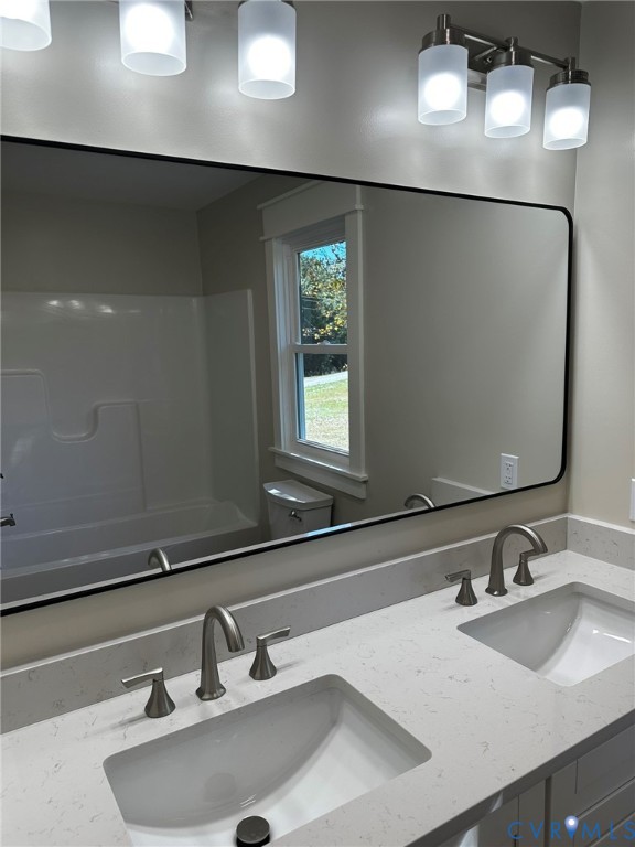 595 Liberty Road Alberta, VA 23821 - Photo 24 of 24 a bathroom with a sink and a mirror