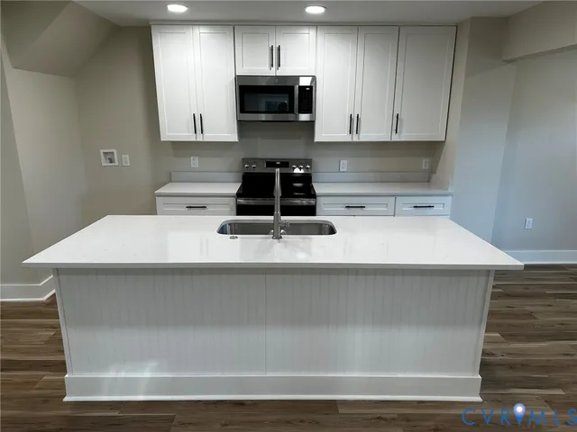 a kitchen with a stove and a microwave