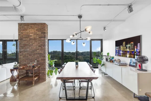 a kitchen with a sink appliances and a counter top space