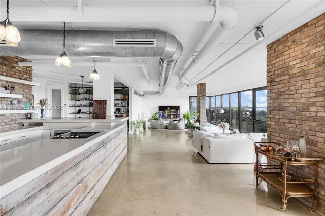 a dining room with furniture and a book shelf