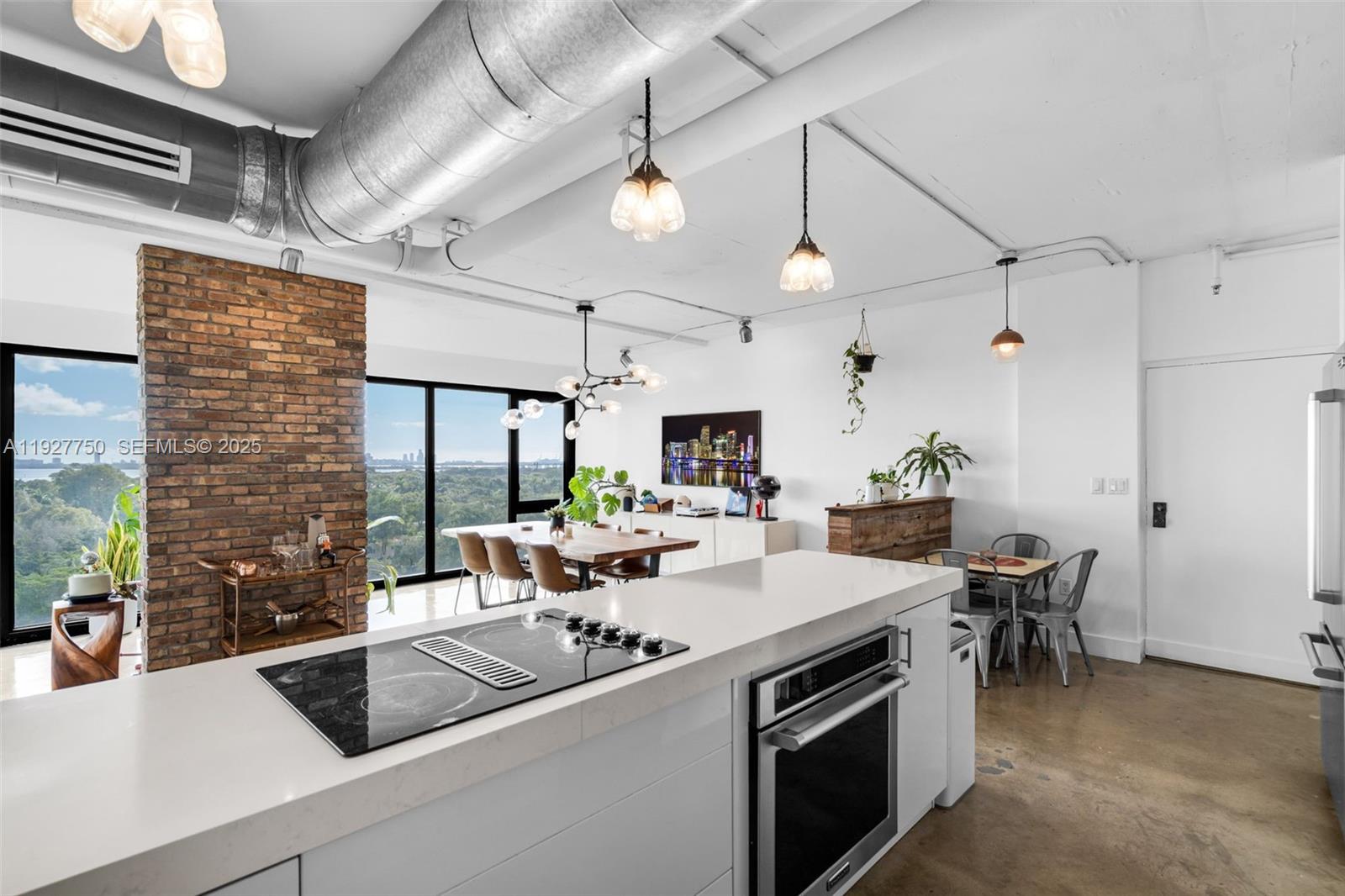 5701 Biscayne Boulevard, Unit PH9 Miami, FL 33137 - Photo 14 of 40 a kitchen with a sink appliances and a counter top space