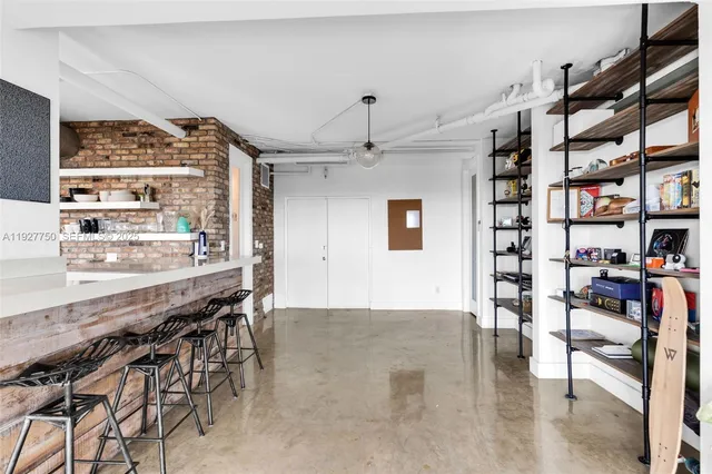 a bedroom with a large bed and a large window