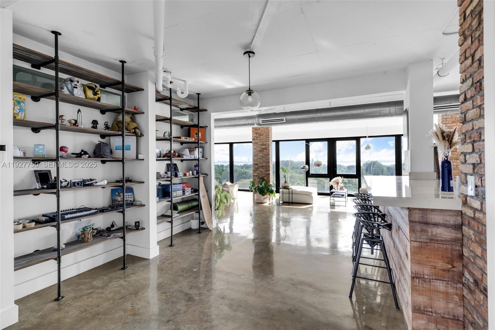 5701 Biscayne Boulevard, Unit PH9 Miami, FL 33137 - Photo 17 of 40 a view of a living room with furniture