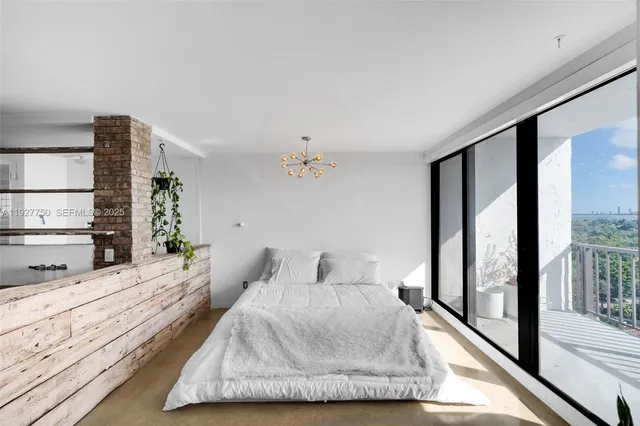 a view of living room with furniture and a chandelier