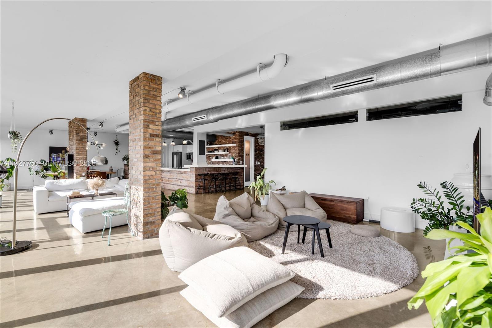 5701 Biscayne Boulevard, Unit PH9 Miami, FL 33137 - Photo 2 of 40 a living room with furniture