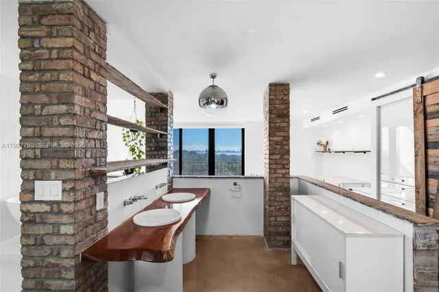 a room with gym equipment and a large window