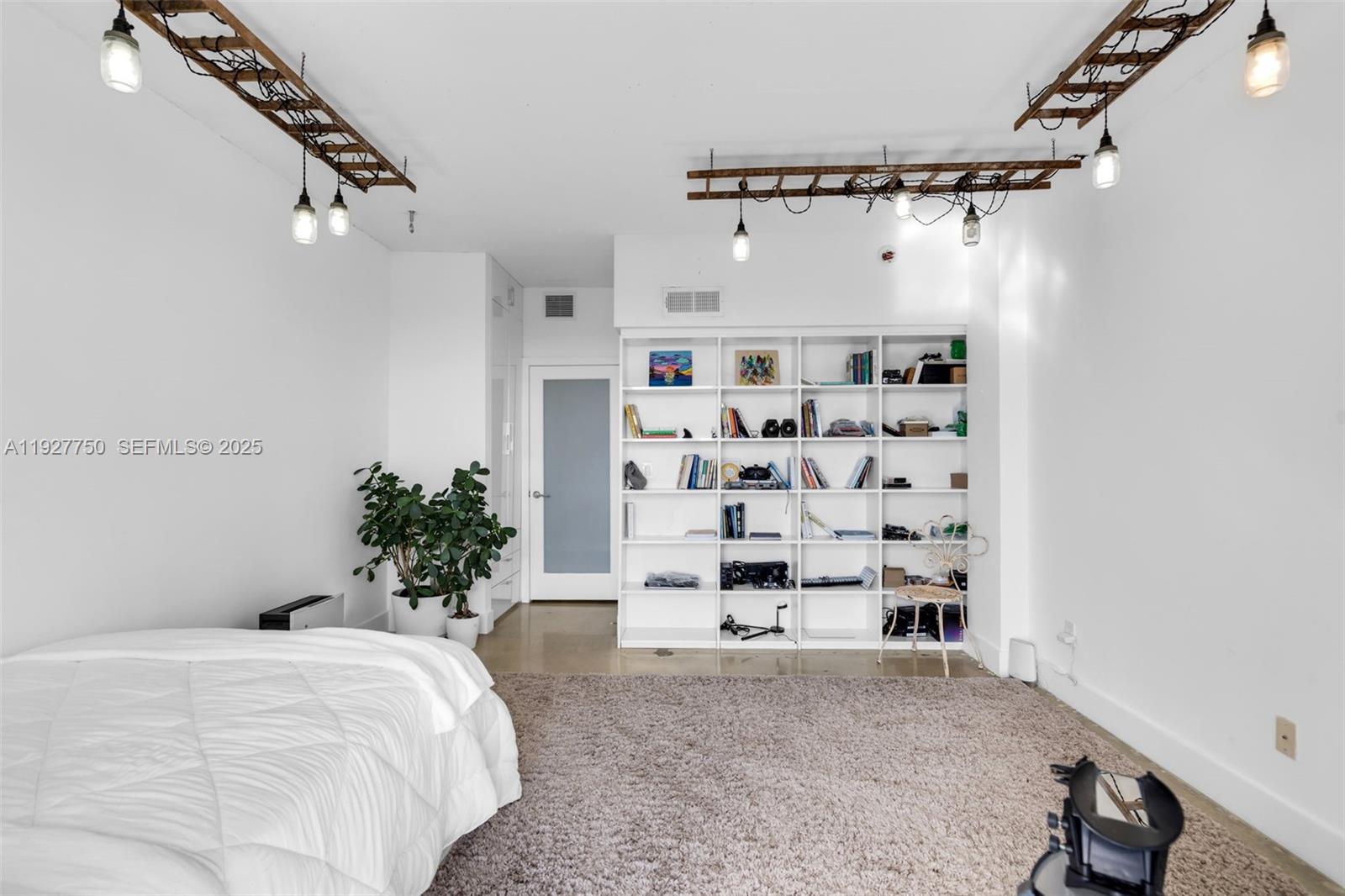 5701 Biscayne Boulevard, Unit PH9 Miami, FL 33137 - Photo 28 of 40 a bedroom with a large bed and a white bath tub