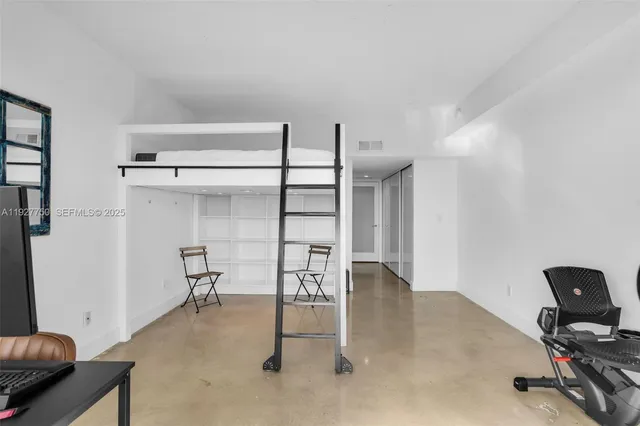 a view of a swimming pool with outdoor seating