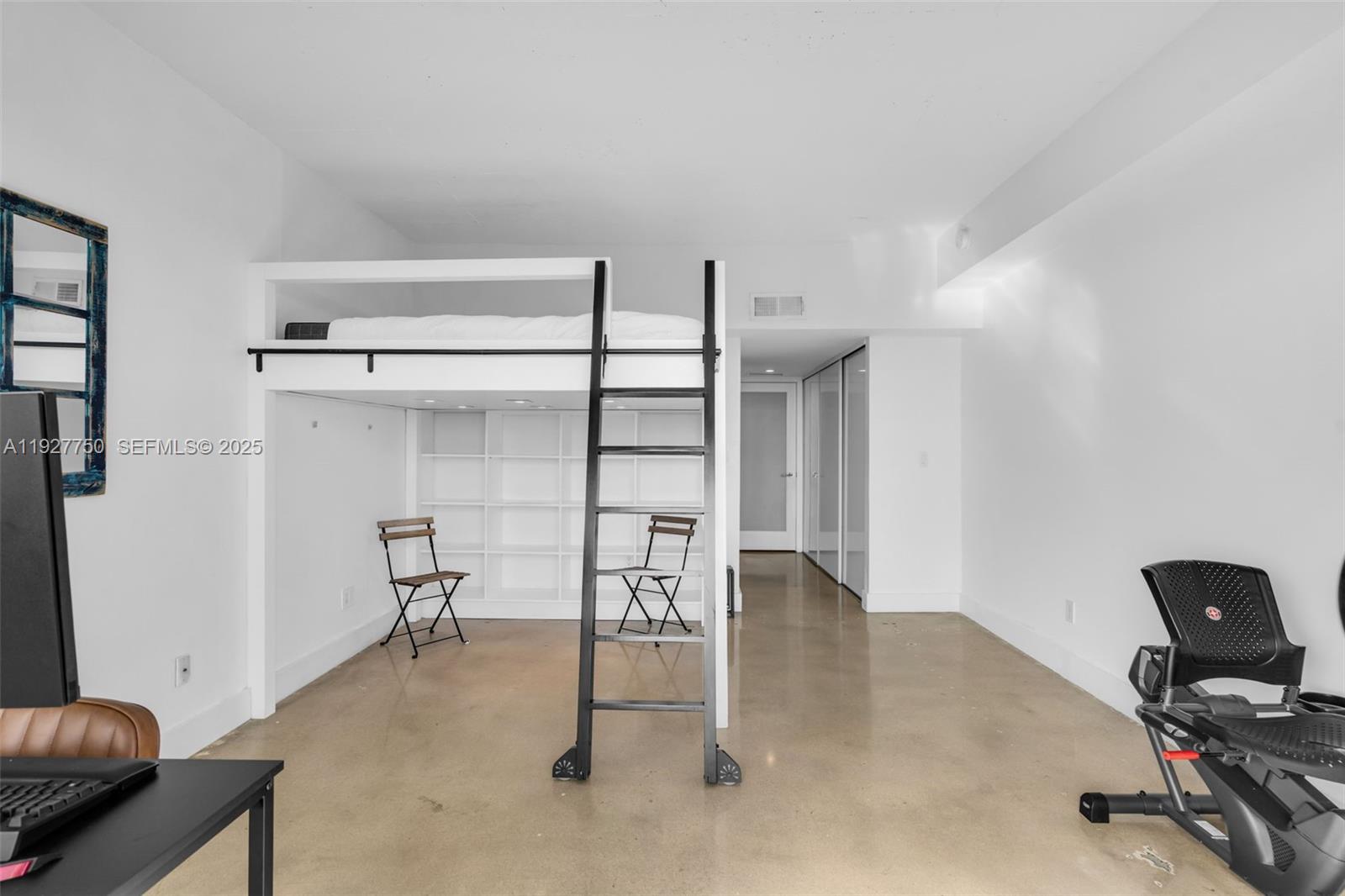 5701 Biscayne Boulevard, Unit PH9 Miami, FL 33137 - Photo 31 of 40 a view of a room with shelves