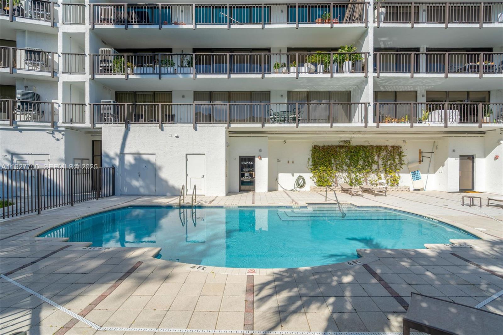 5701 Biscayne Boulevard, Unit PH9 Miami, FL 33137 - Photo 36 of 40 a view of a swimming pool with outdoor seating