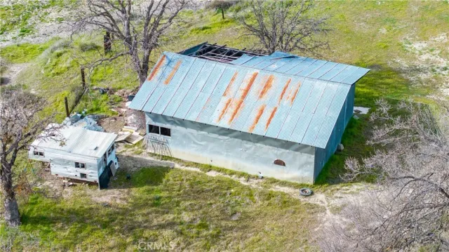 a view of backyard with a small cabin